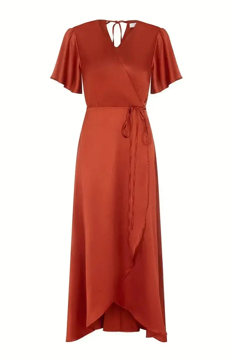Burnt orange bridesmaid dress with a tie waist on a white background