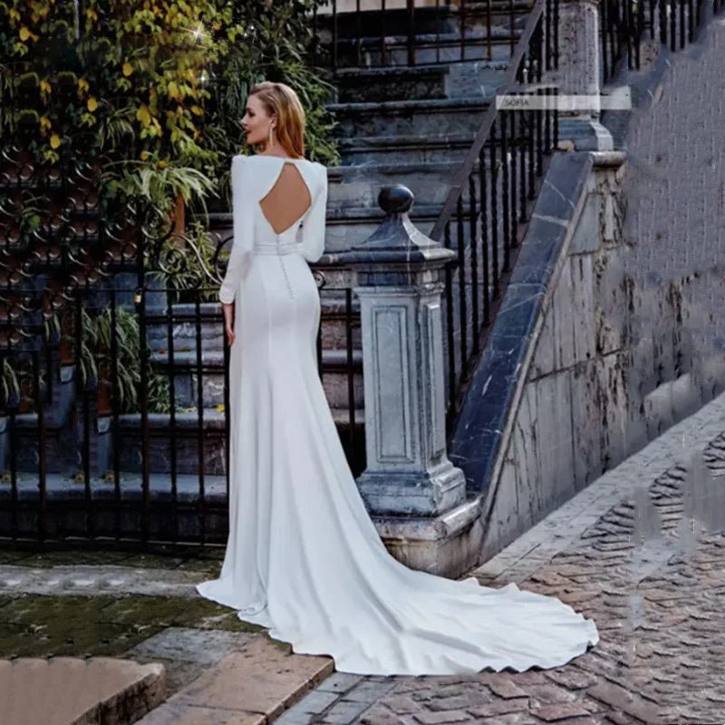 back view of a bride wearing a Classic Long Sleeve Backless Mermaid Wedding Dress with Square Collar