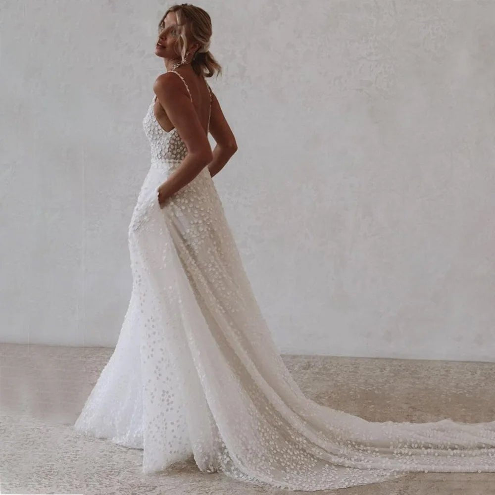 Bride wearing a Deep V-Neck Wedding Dress with Pockets and Spaghetti Straps