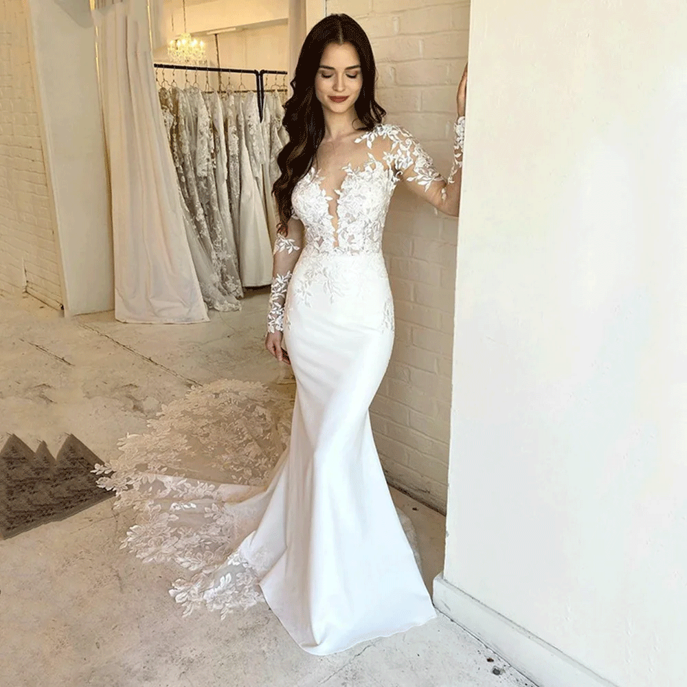 Bride wearing a white Elegant Lace Mermaid Appliqued Dress with Long Sleeves