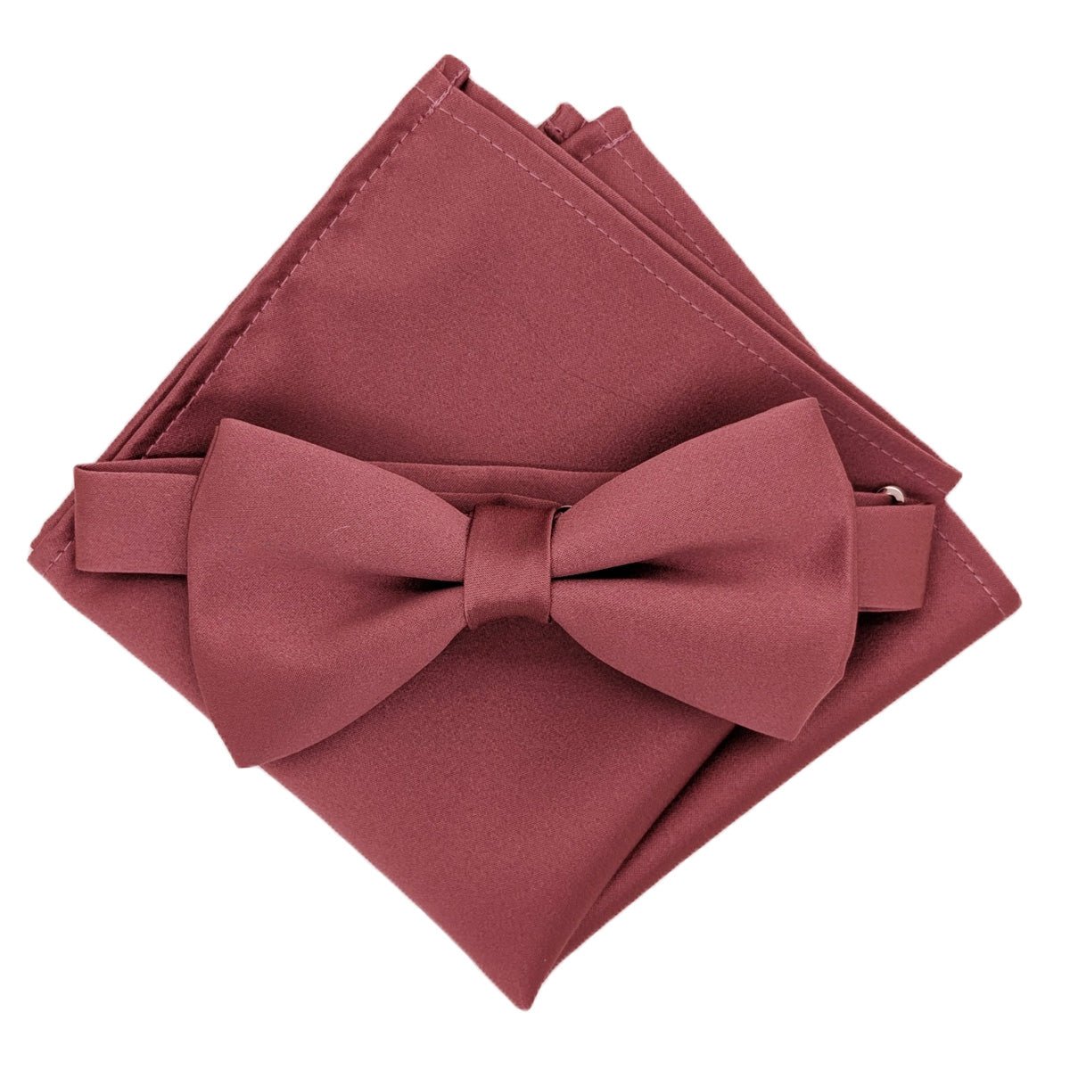 A deep mauve coloured bow tie and pocket square set.