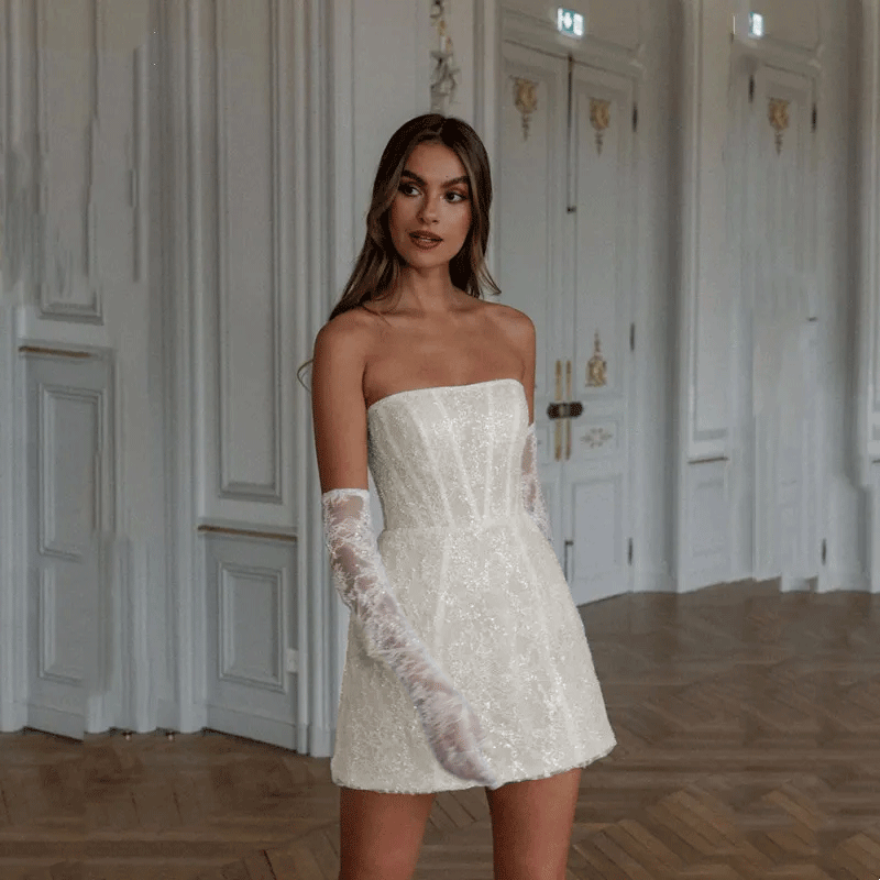 Front view of a bride wearing an ivory Mini Sequined Strapless Short A-Line Wedding Dress
