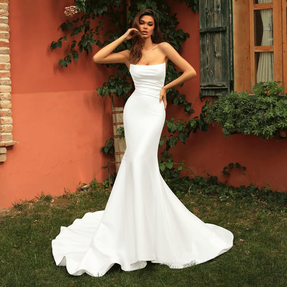 Front view of a bride wearing a White Chic Satin Strapless Backless Mermaid Wedding Dress