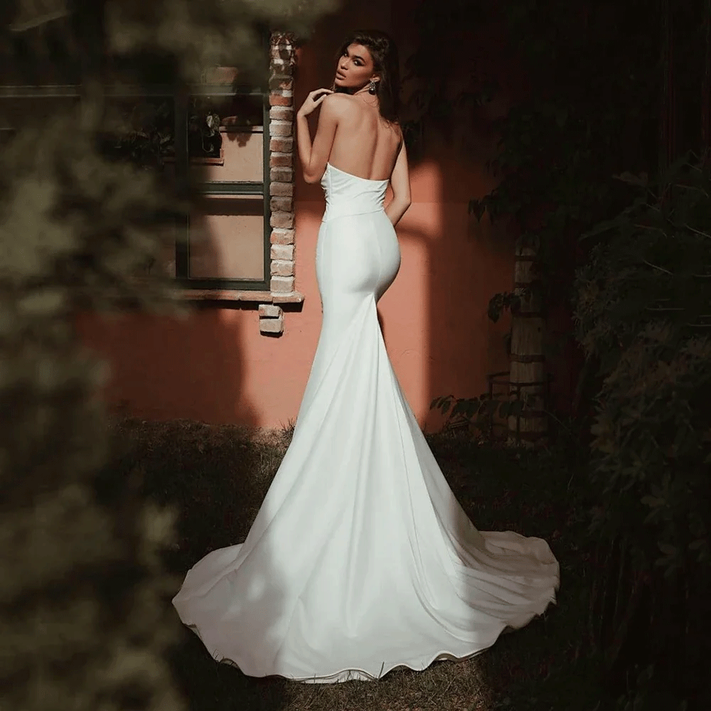 Rear view of a bride wearing a Chic Satin Strapless Backless Mermaid Wedding Dress