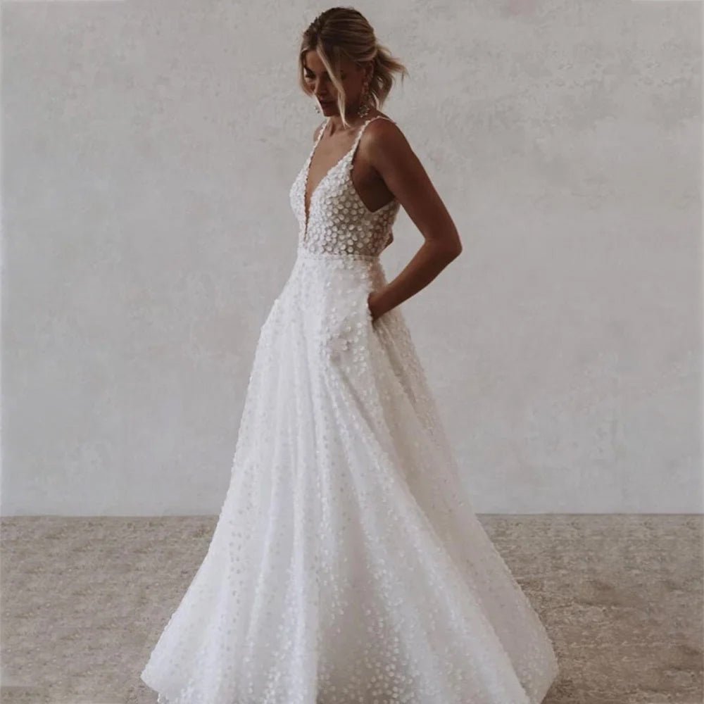 Side view of a bride wearing a Deep V-Neck Wedding Dress with Pockets and Spaghetti Straps