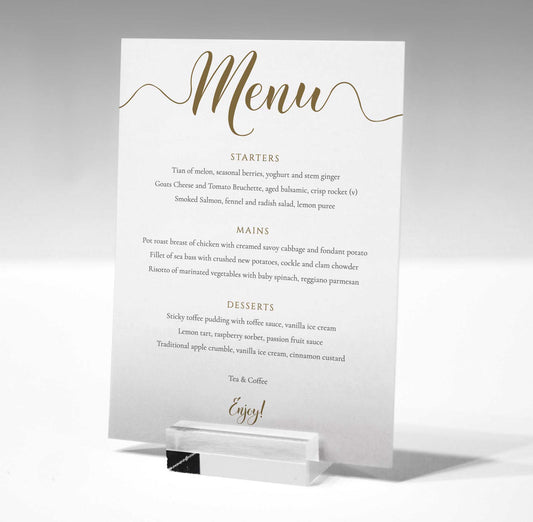 5"x7" gold wedding menu printed on white card in a glass stand