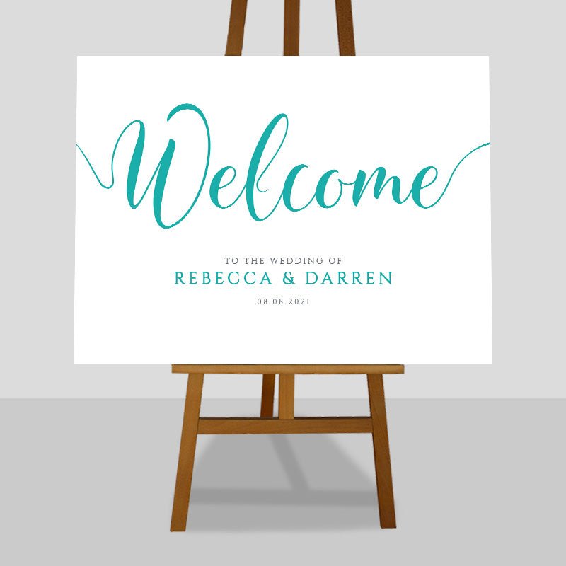 aqua wedding welcome sign on an easel