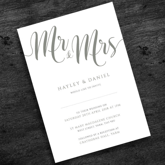 artichoke green wedding invitation on wooden table
