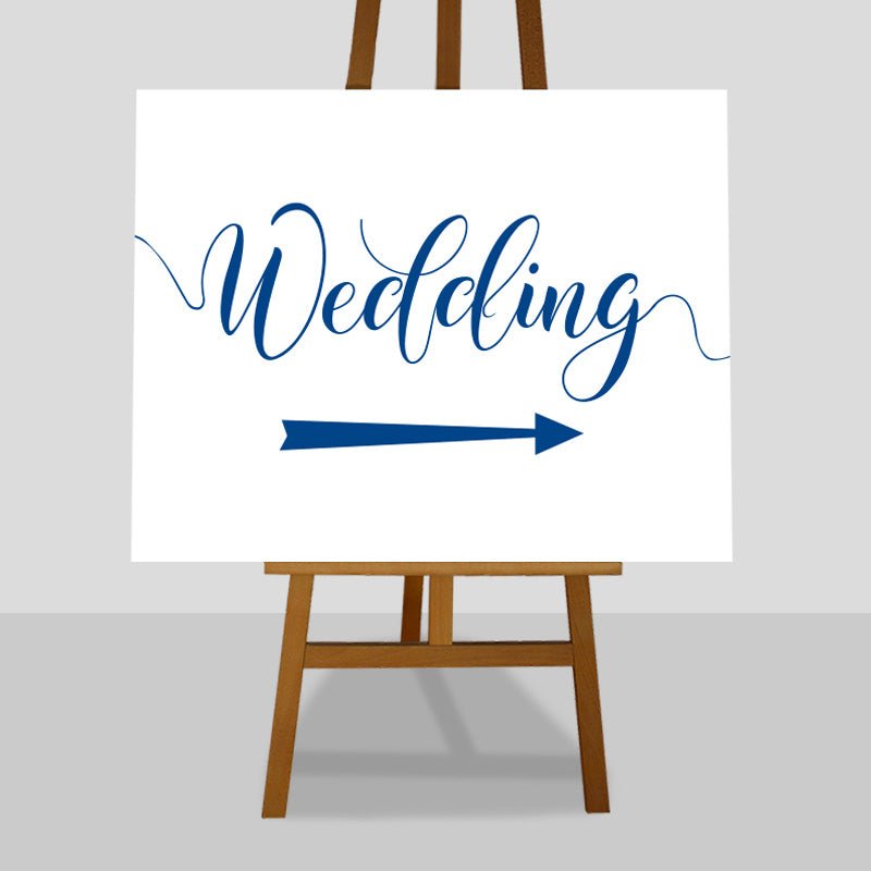 azure blue wedding arrow sign on easel