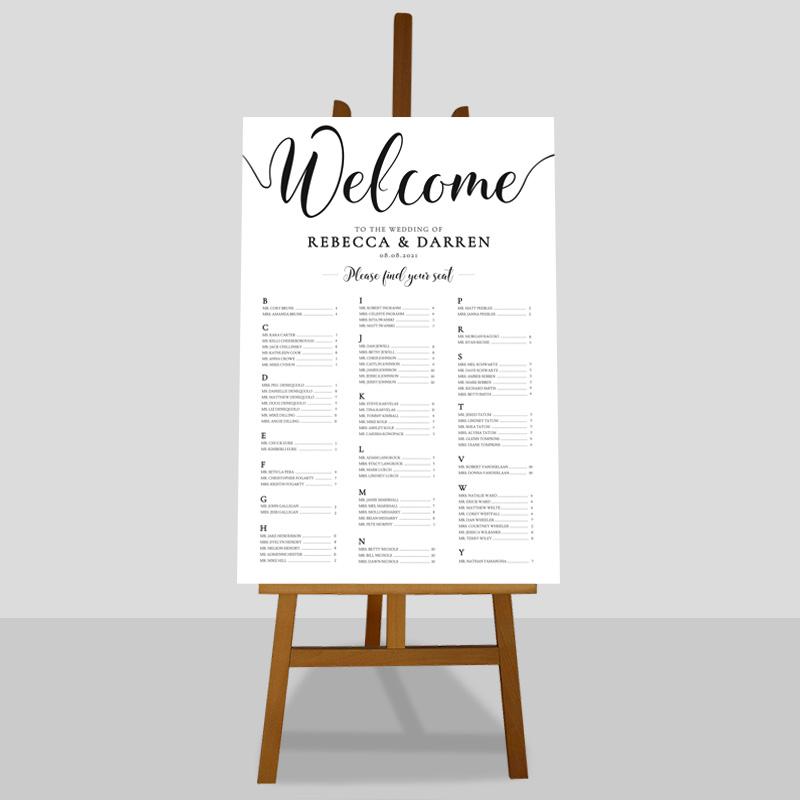 elegant alphabetical 3-column table plan on an easel with a plain background