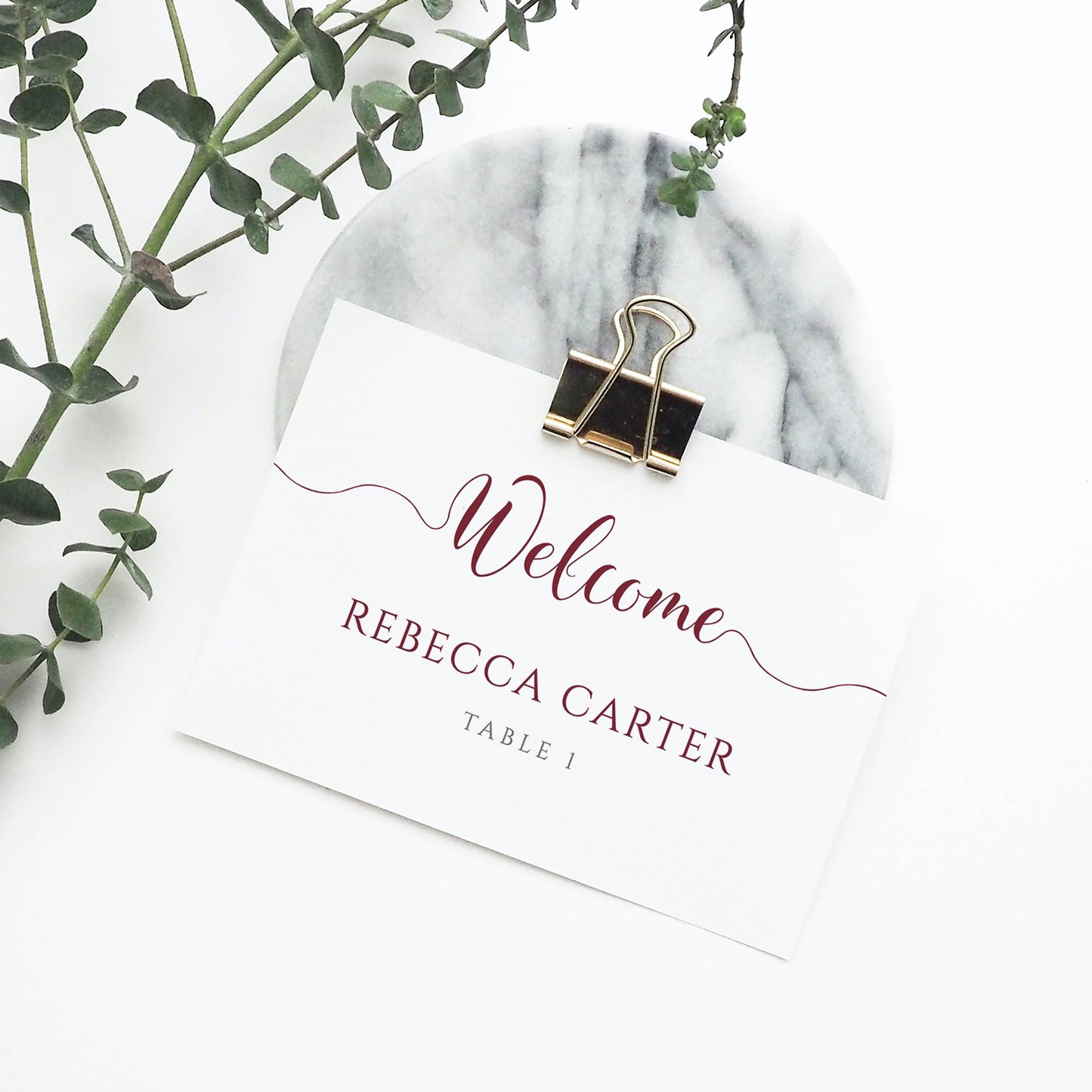 burgundy place card in metal clip