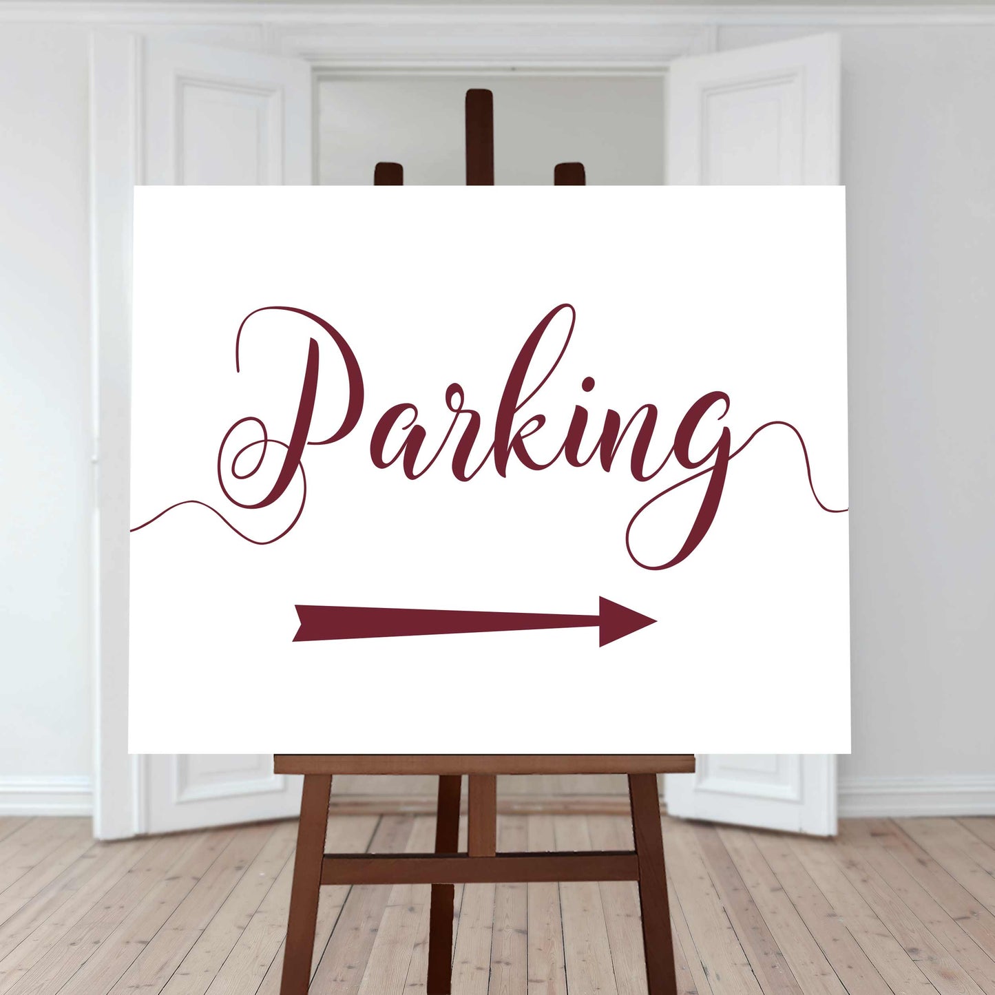 deep red wedding car park directions sign with an arrow pointing right
