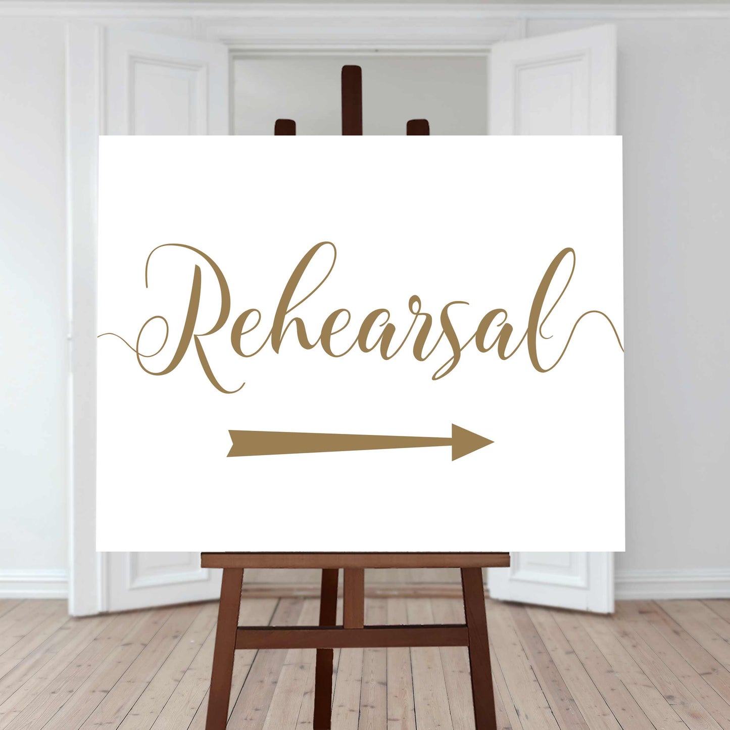 gold wedding rehearsal arrow sign
