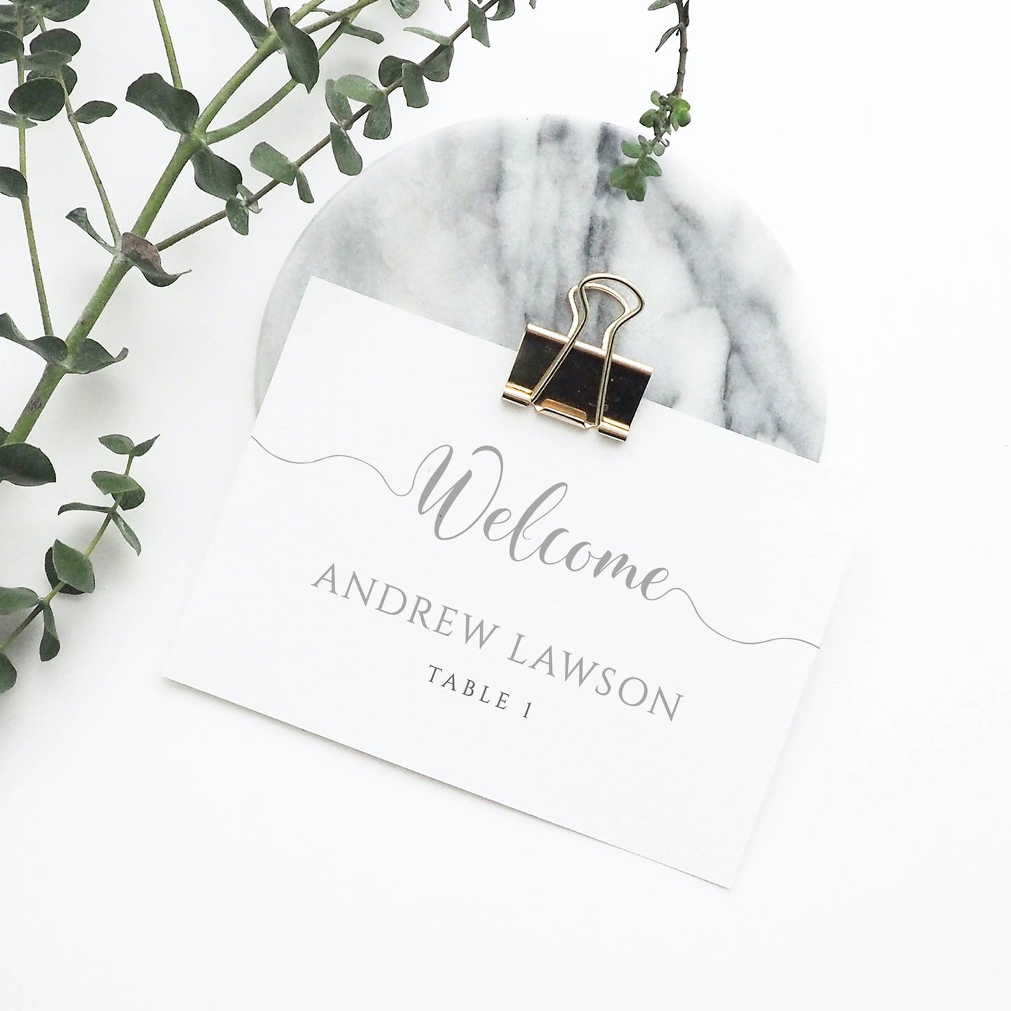 grey wedding place card in metal clip