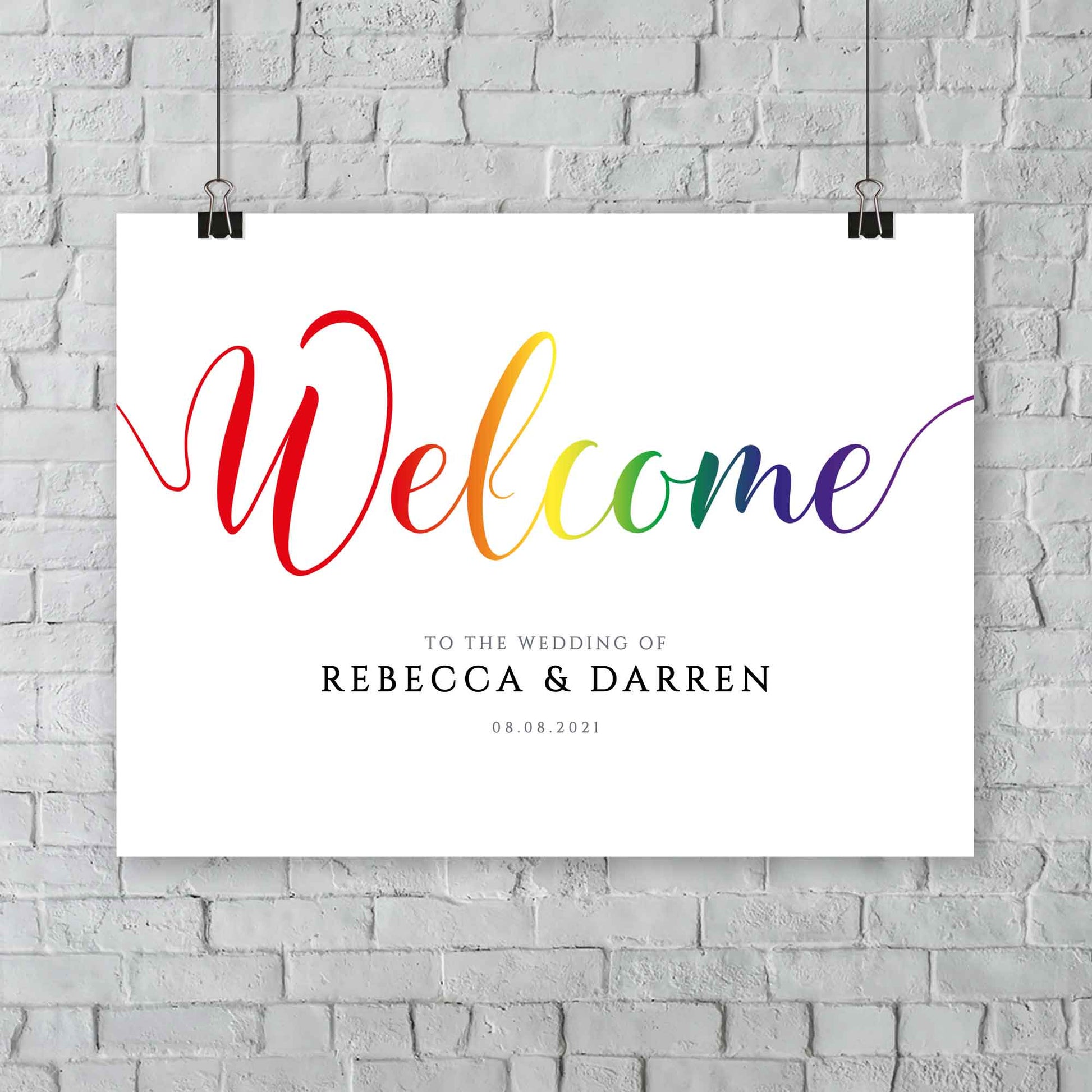 printable rainbow wedding welcome sign at an outdoor wedding