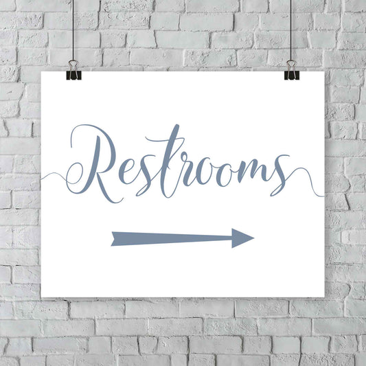 misty blue wedding restrooms arrow signage hanging from a wall