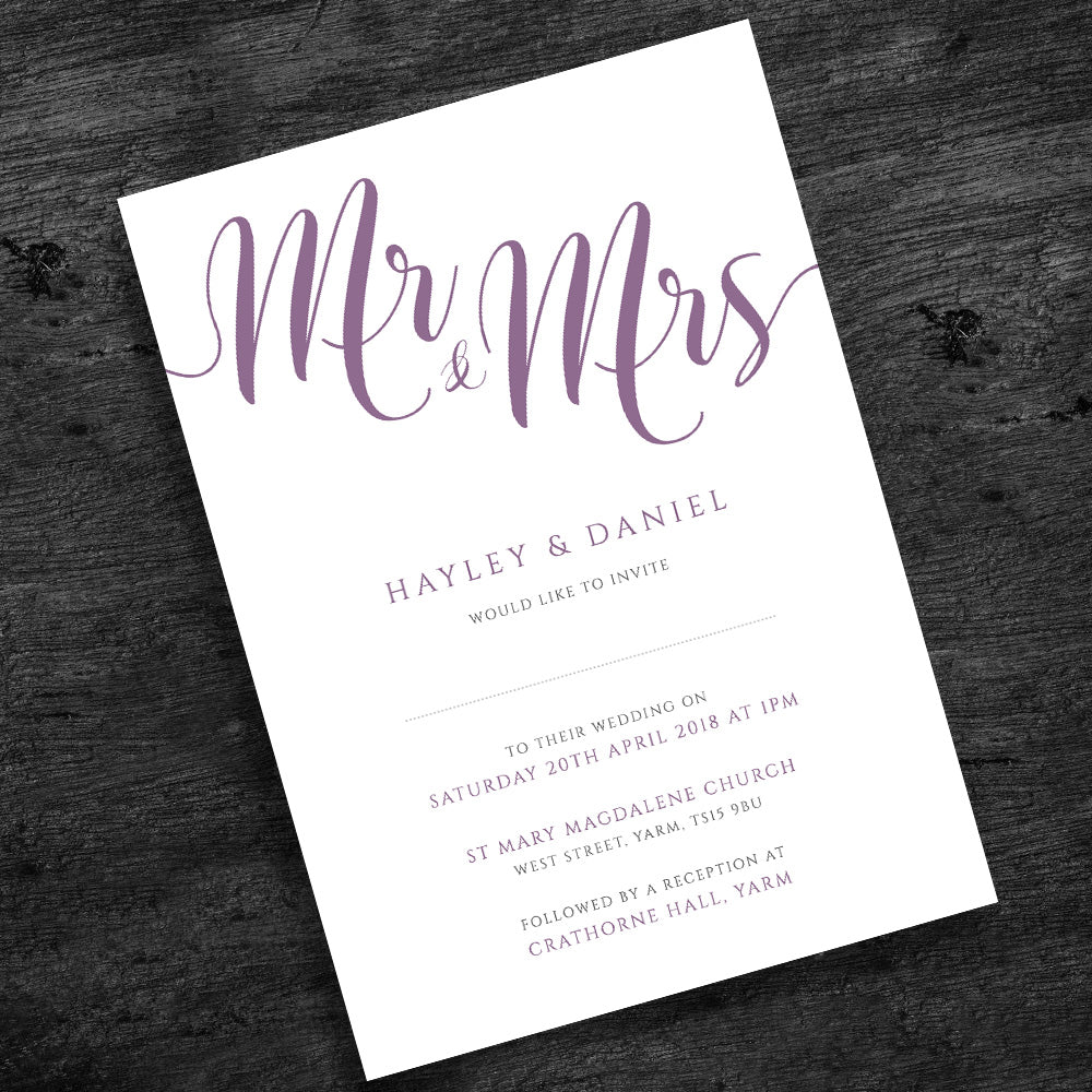 orchid purple wedding invitation on wooden table