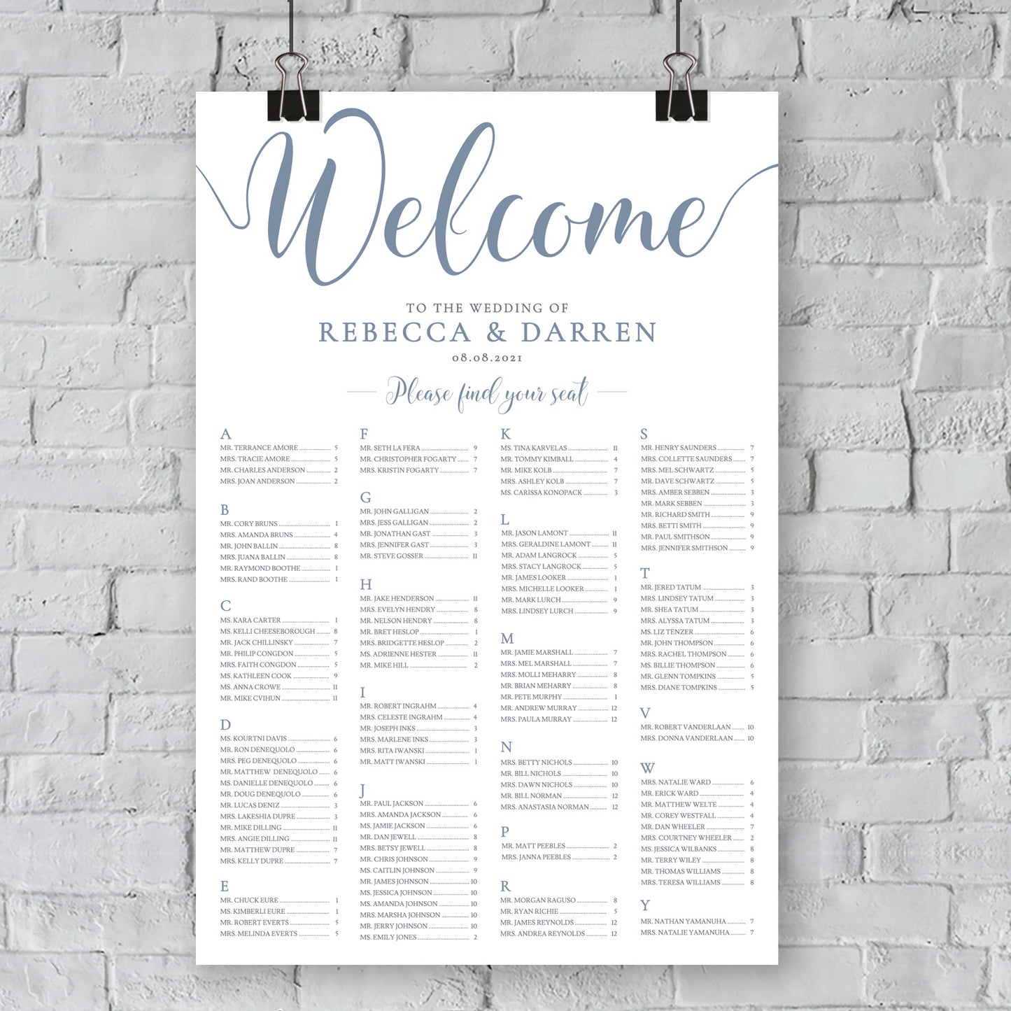 outdoor wedding seating plan hanging on wall