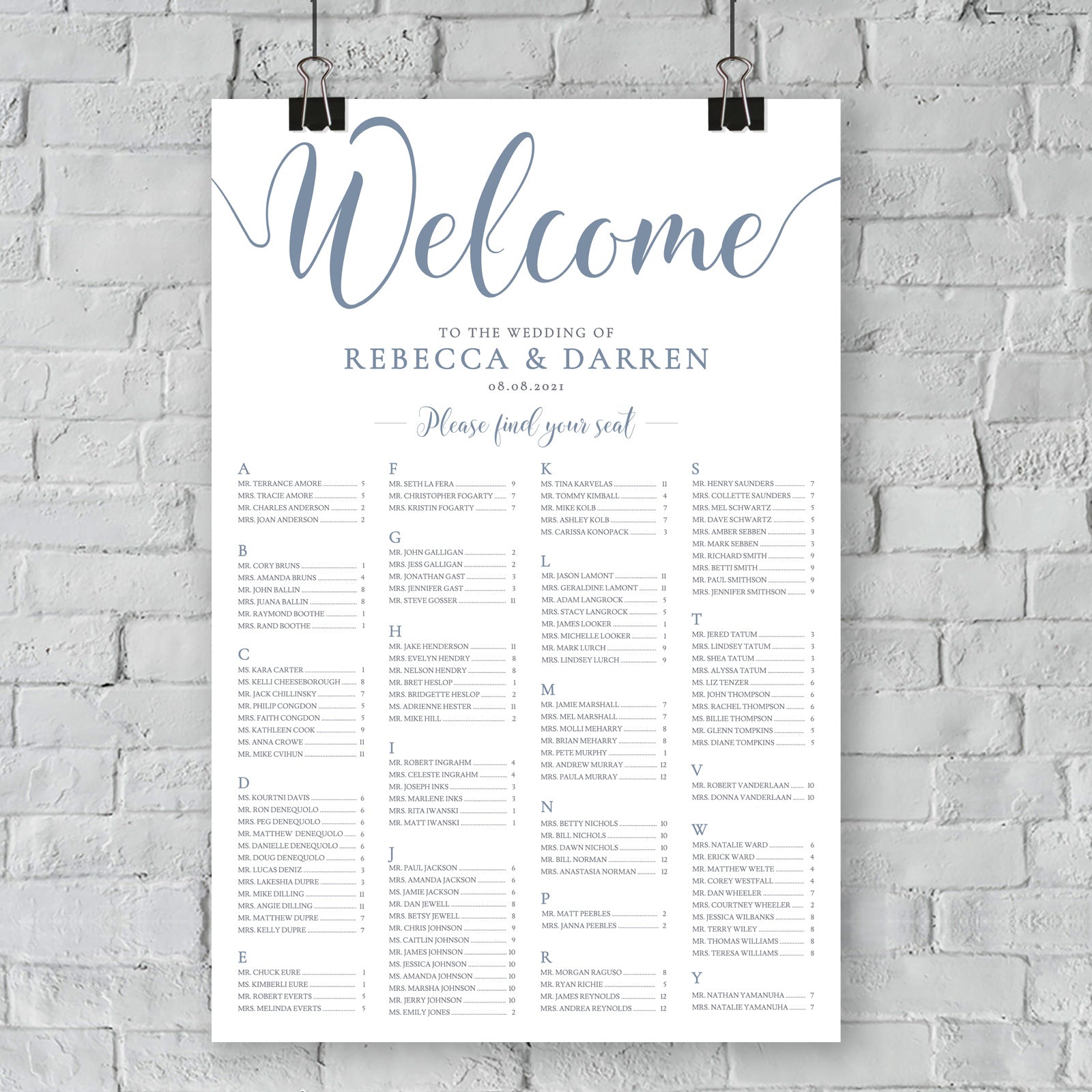 outdoor wedding seating plan hanging on wall