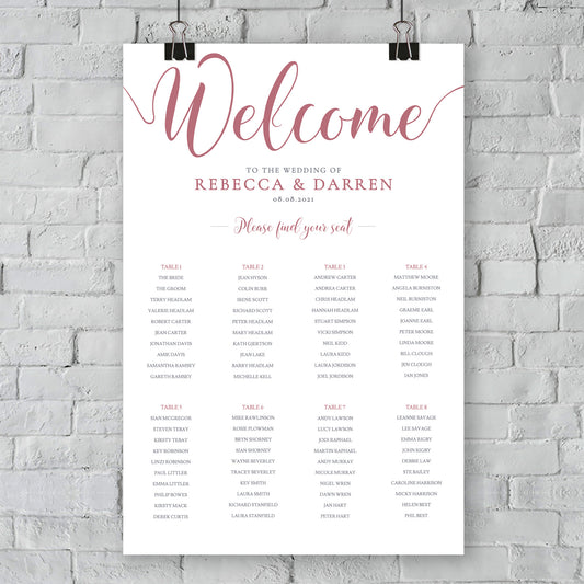 pink table plan hanging on wall