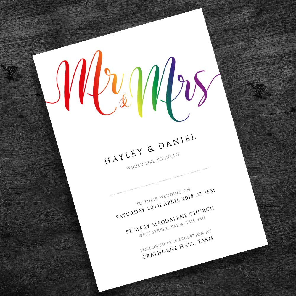 5"x7" rainbow wedding invite on rustic wood background
