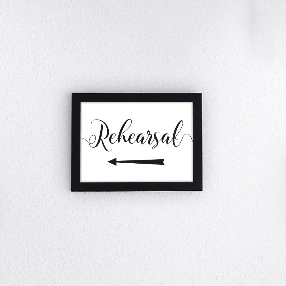 rehearsal directions signage with an arrow pointing left