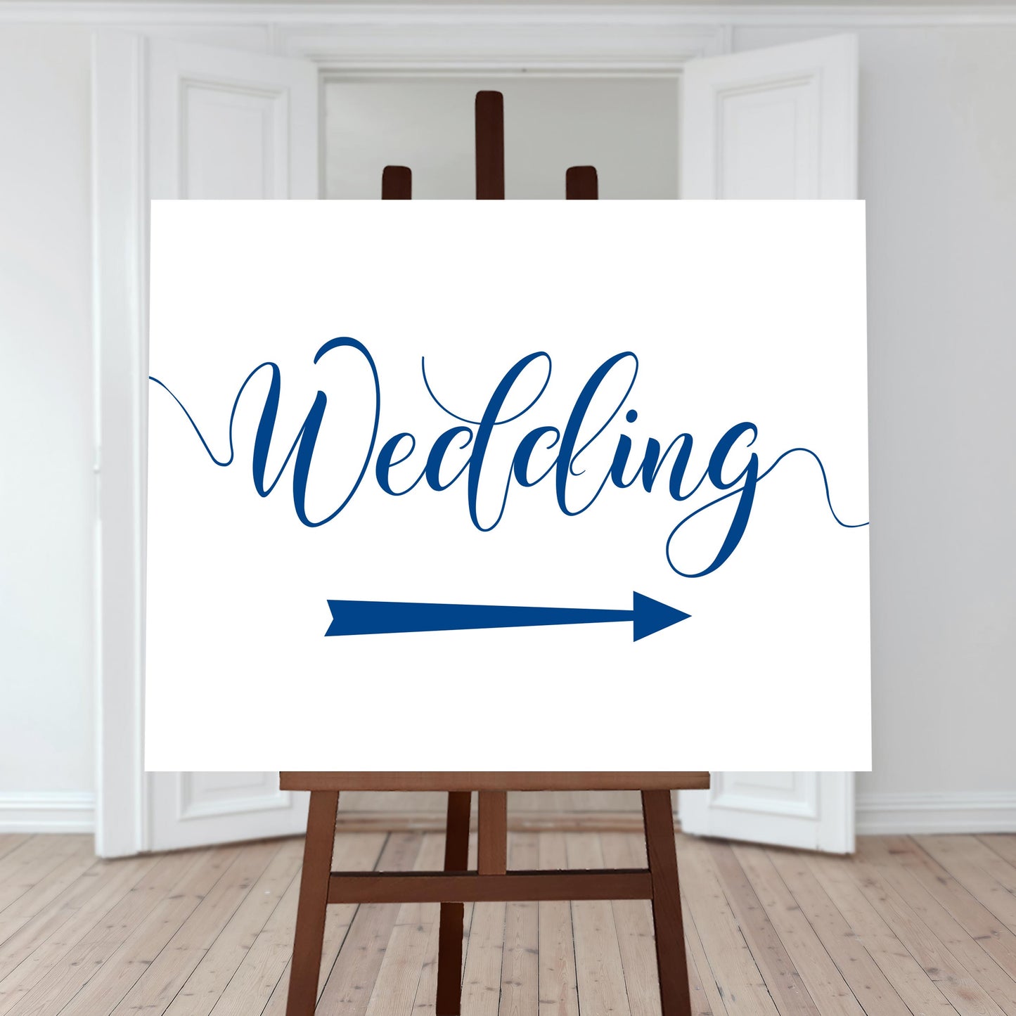 royal blue wedding directions sign with a right arrow