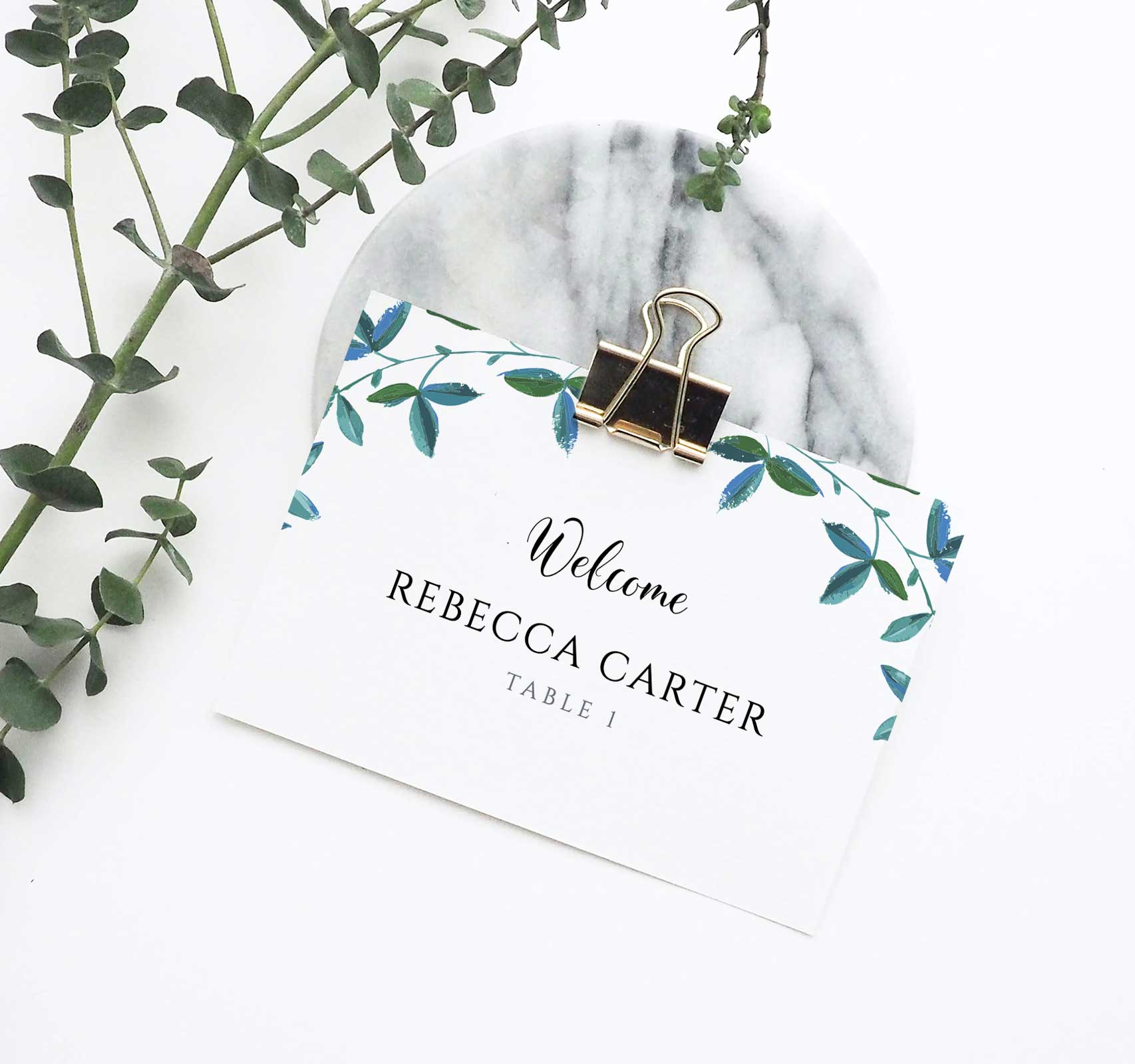 rustic 3.5 x 2.75 place card with greenery border and a metal clip