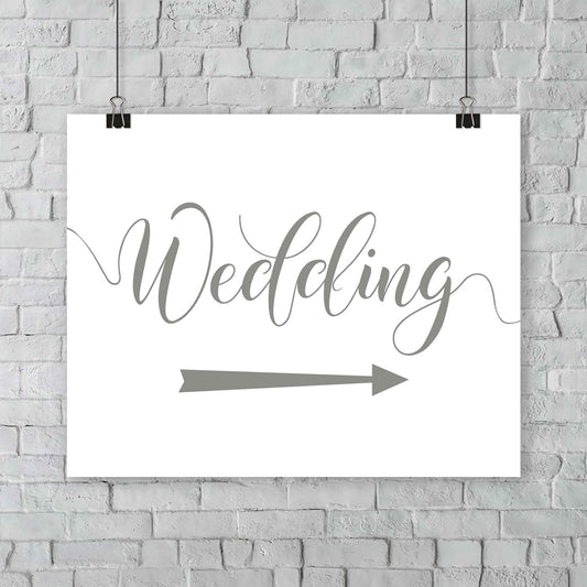 sage green wedding arrow sign print hanging from a wall