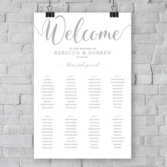 silver seating chart on wall at an outdoor wedding