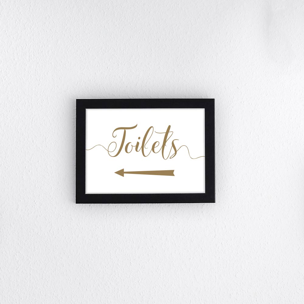 toilets this way left arrow in a black picture frame