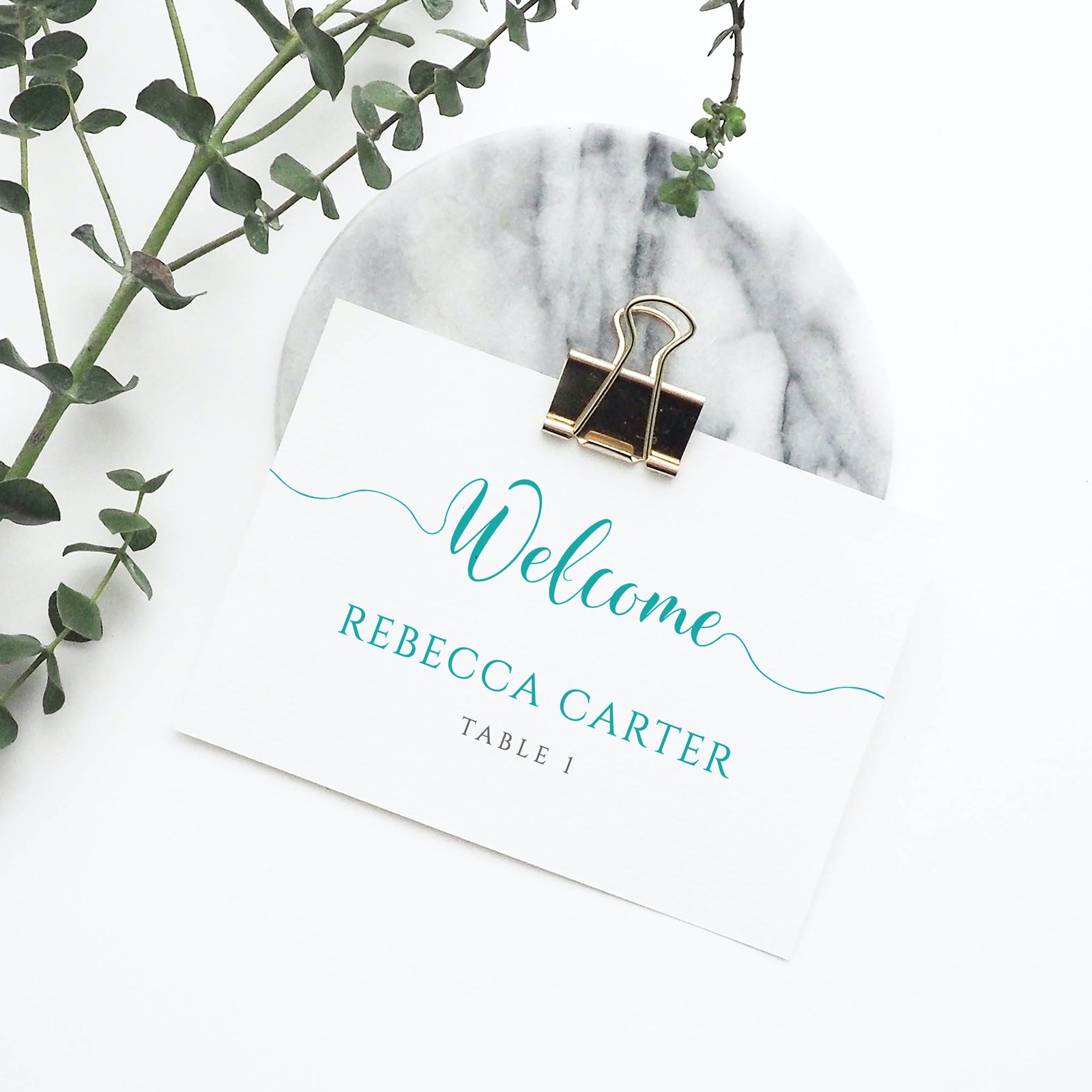 turquoise place card in metal clip