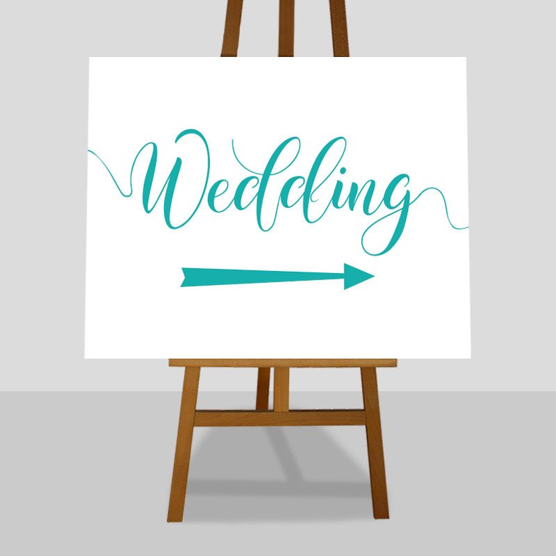 turquoise wedding arrow sign on easel