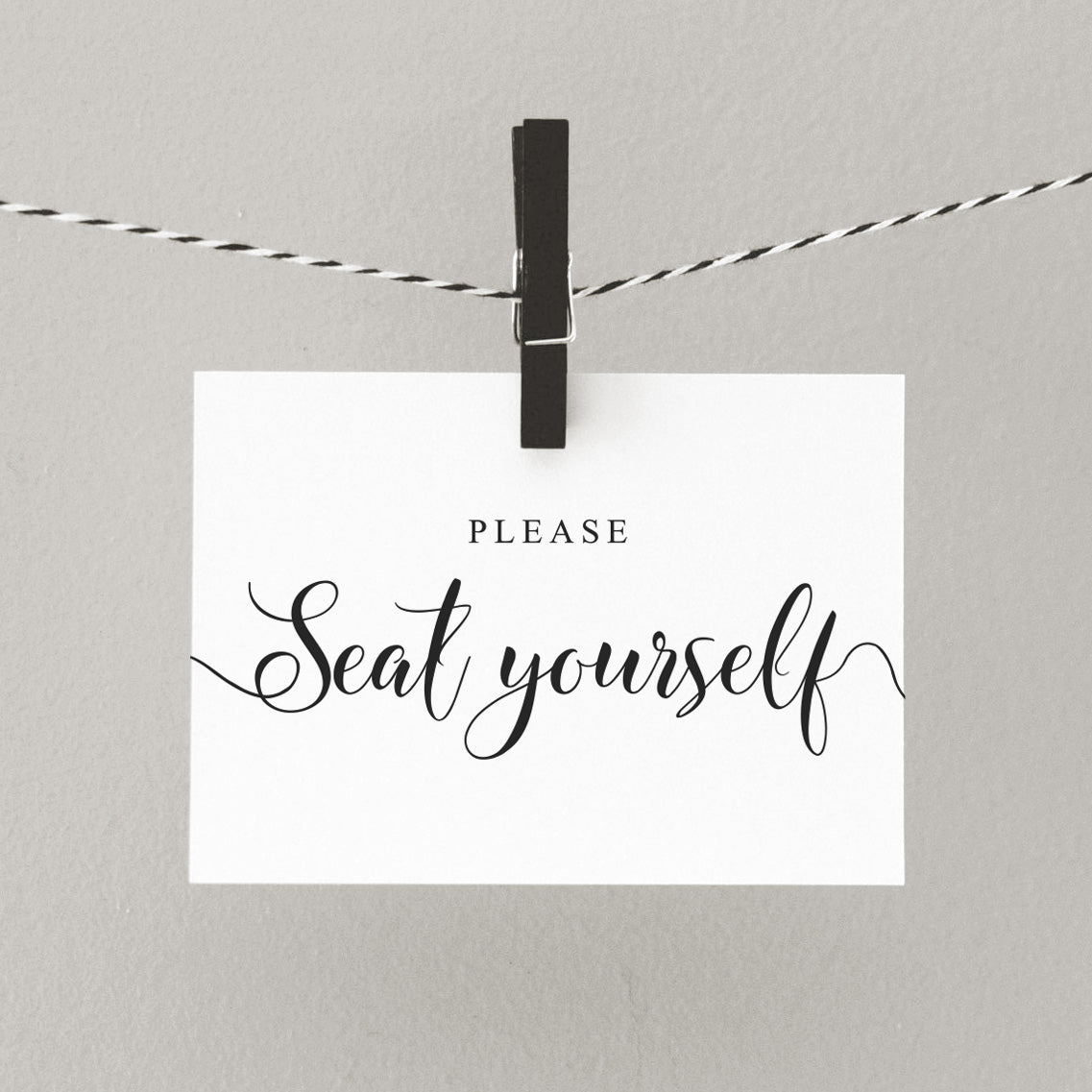 Printed wedding sign letting guests know to seat themselves