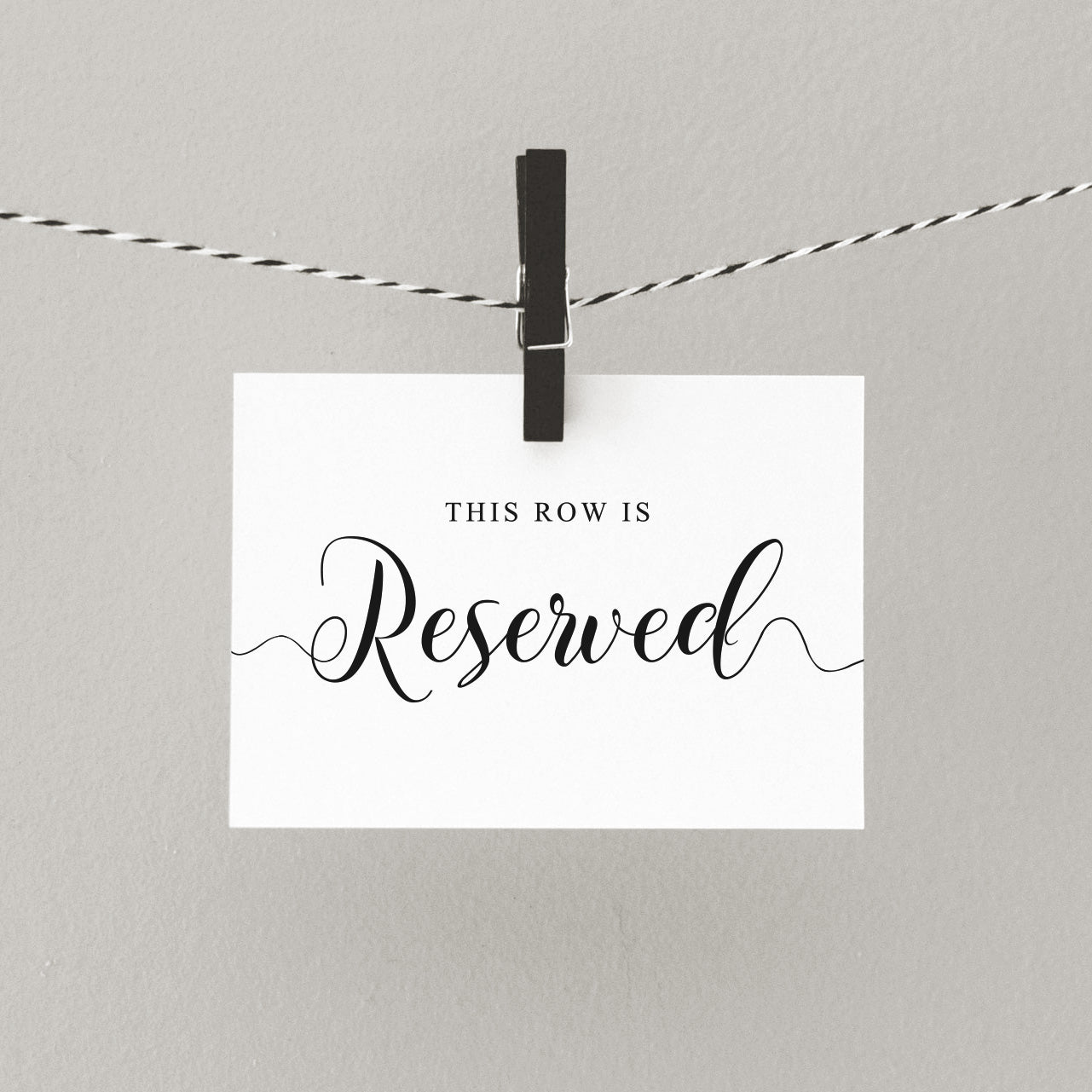 This row is reserved printed sign hanging from a peg
