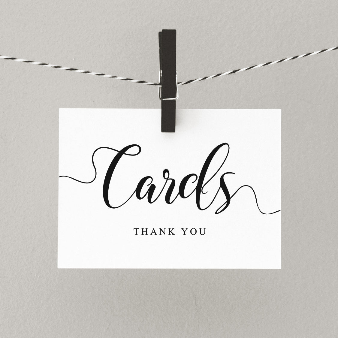 printed wedding cards sign pegged on a line