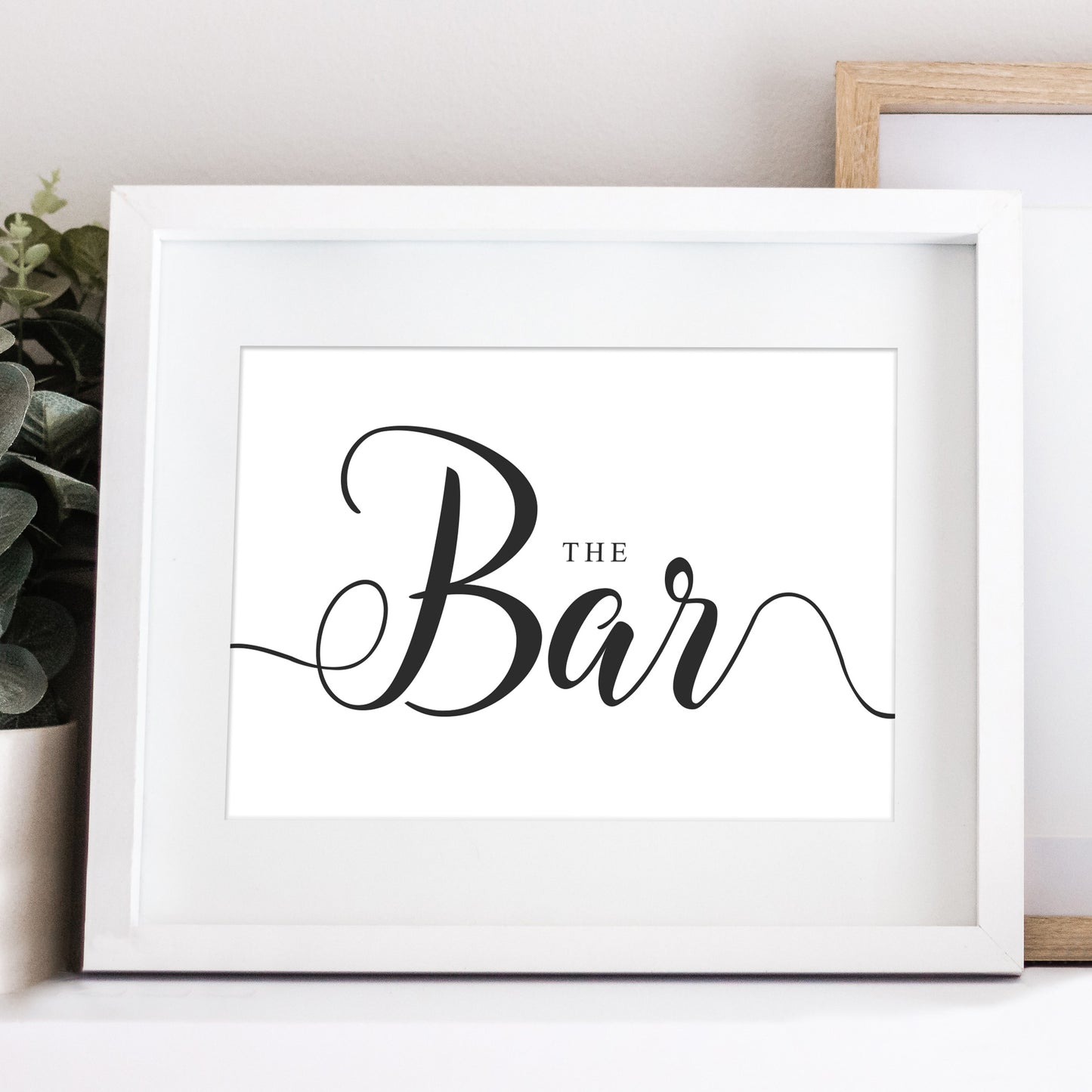 Outside bar sign for weddings in a white frame