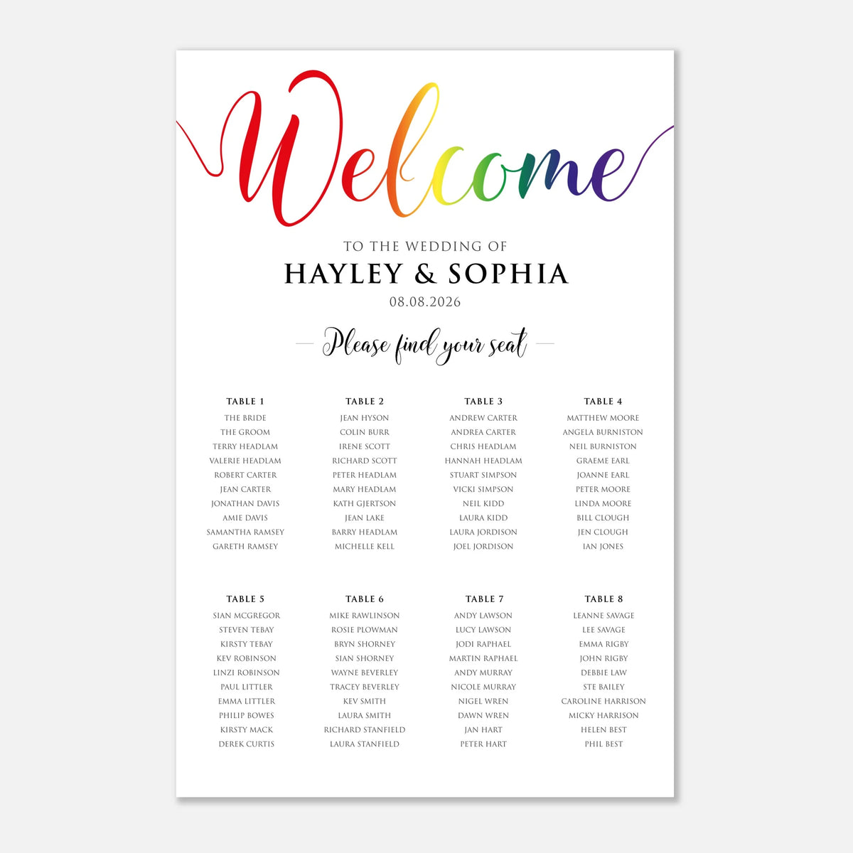A wedding seating chart print with a colorful 'Welcome' header in a rainbow watercolor style, printed on a white card with black text and table listings, shown on a light gray background.