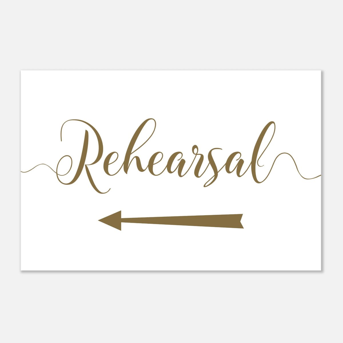 A white rectangular sign with the word 'Rehearsal' in elegant brown script and a matching brown arrow pointing left, shown on a light gray background.