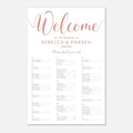 A wedding reception welcome seating chart print with elegant rose gold script and serif text on a white background, displayed against a light gray backdrop.