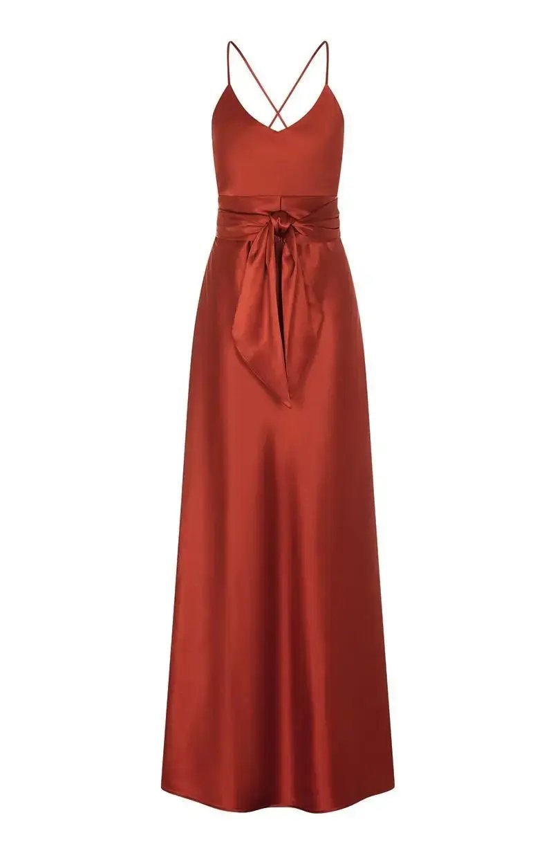burnt orange evening bridesmaid gown with a belt on a white background