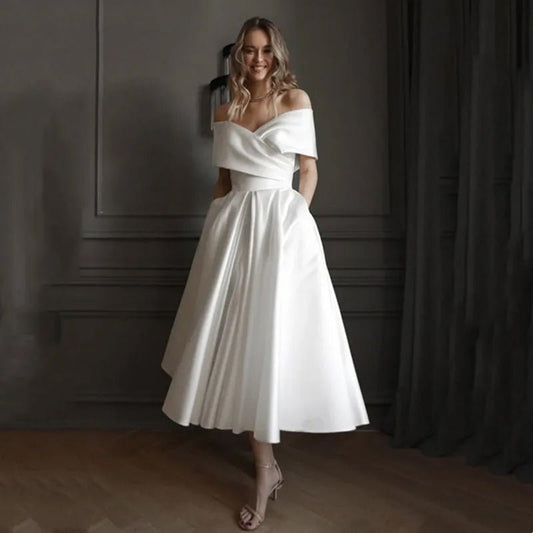 Bride wearing an A-Line Ankle-Length Off-The-Shoulder Wedding Dress front view