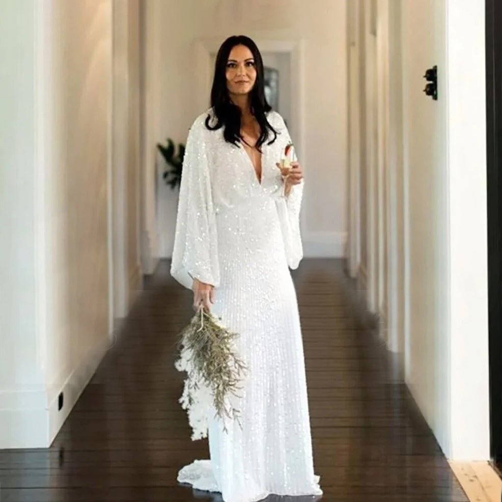 Bride standing in a hallway wearing Luxury Long Sheer Sleeve Deep Backless Wedding Dress