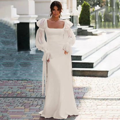 Full-length front view of a bride wearing an Ivory Modern Square Collar Wedding-Dress with Full Puff Sleeves