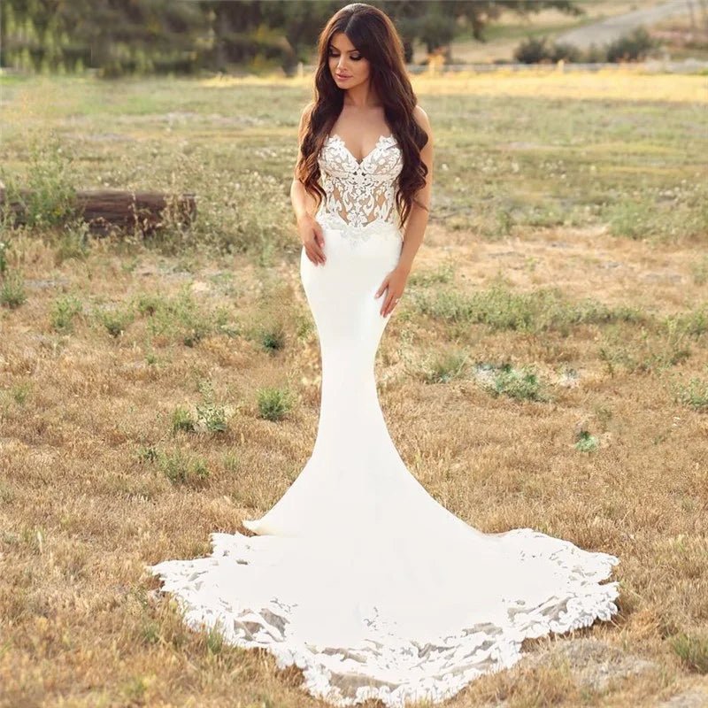 Bride wearing Modern Satin and Lace Mermaid Wedding Dress in a field