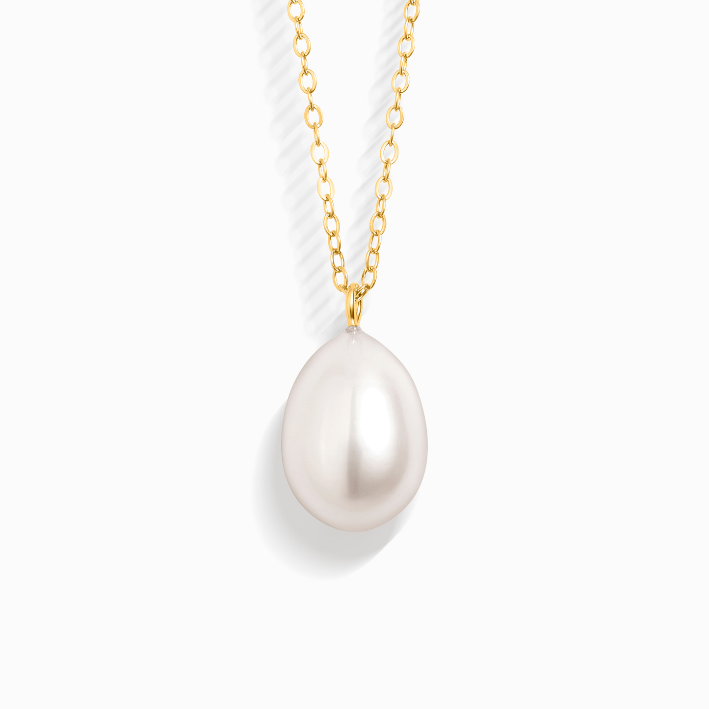 A single pearl pendant on a delicate gold chain, isolated on a white background.