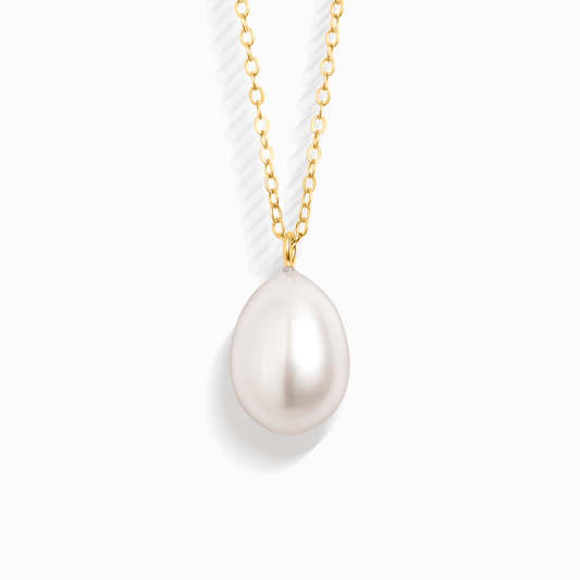 A single pearl pendant on a delicate gold chain, isolated on a white background.