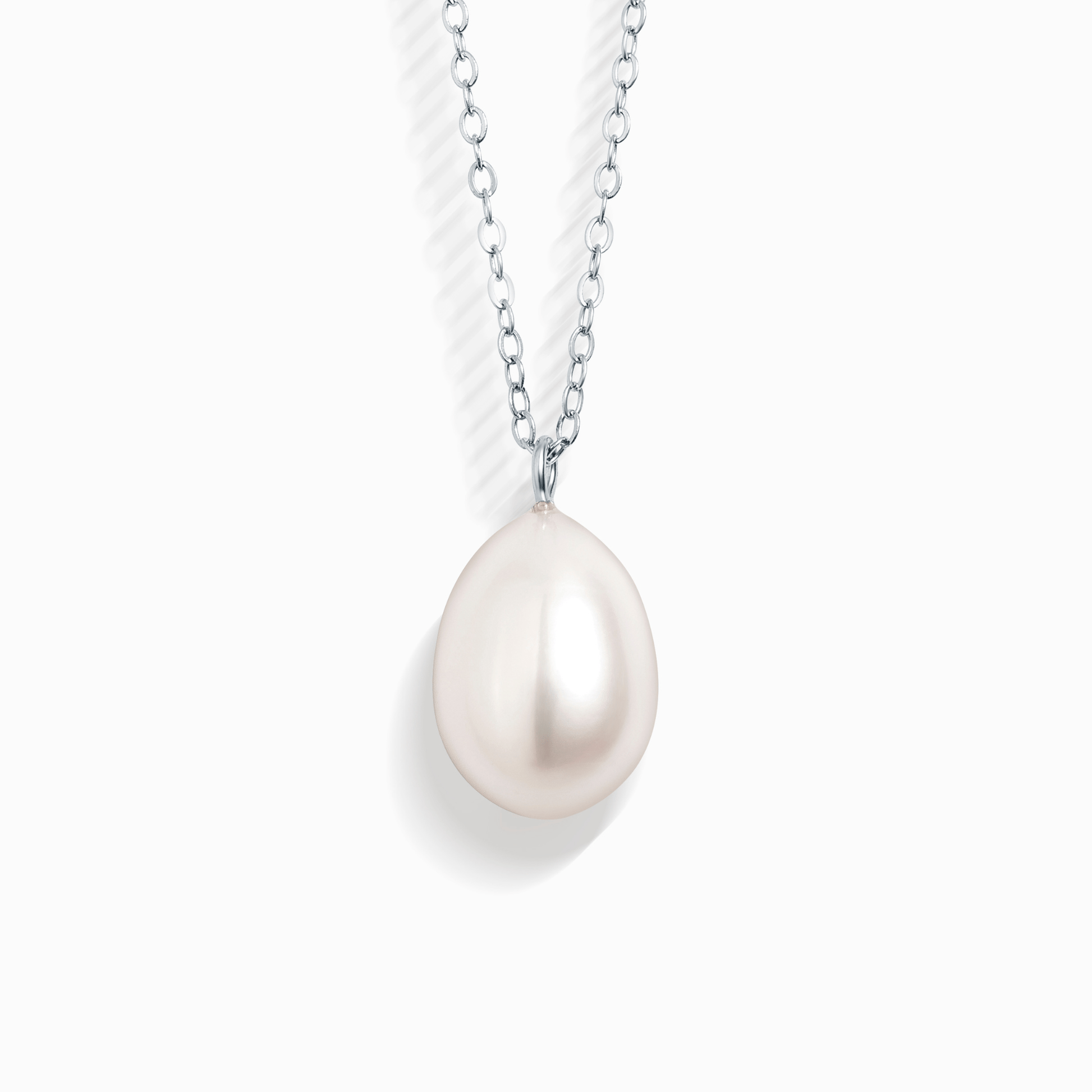 A single pearl pendant necklace with a white tear-drop shaped pearl on a silver chain.