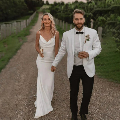 Bride wearing a White Elegant Satin Mermaid Wedding Gown with Spaghetti Straps