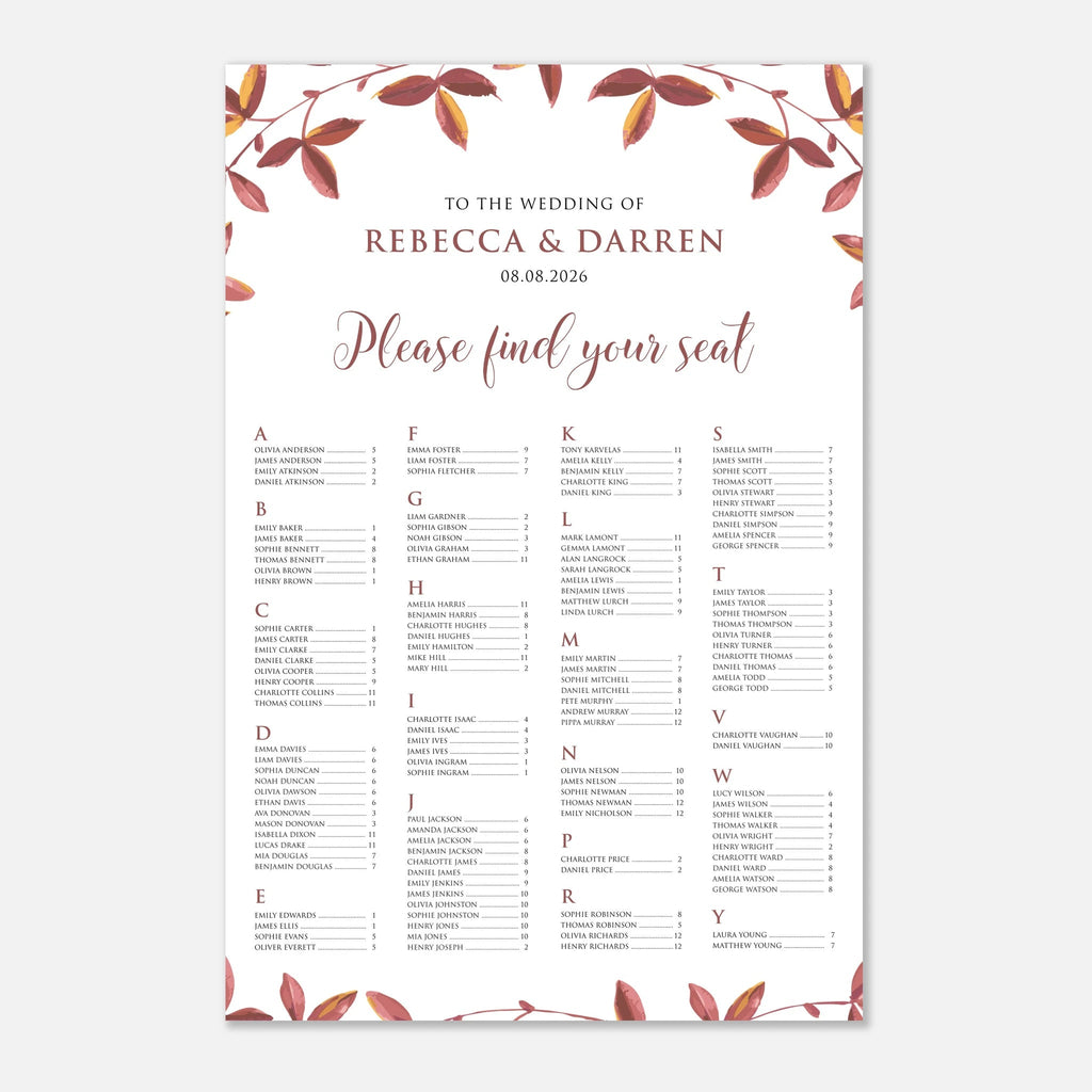 A wedding seating chart print with a white background, elegant rose gold script text, and a border of muted red and brown autumn leaves at the top and bottom.